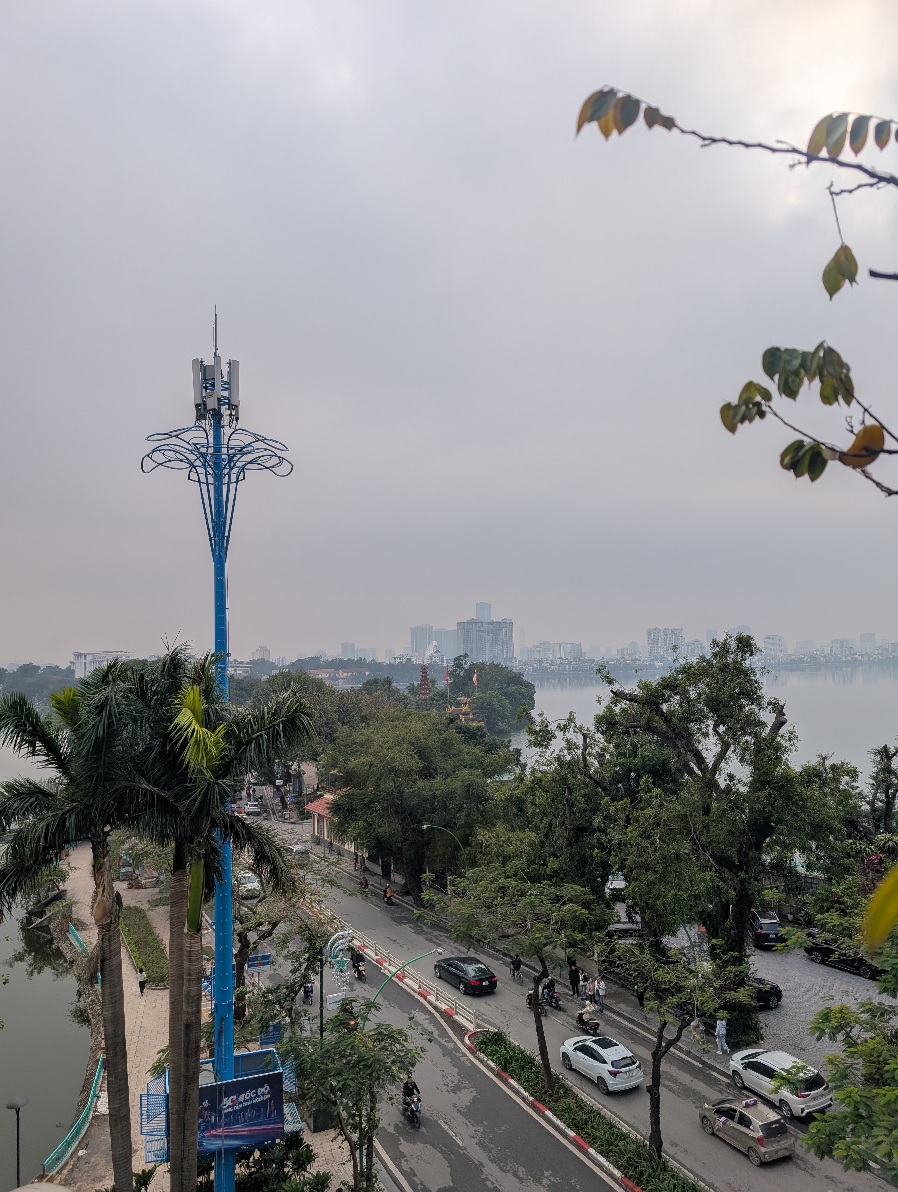 A view over some of hanoi from a rooftop bar in hanoi, quite close to the airport.
