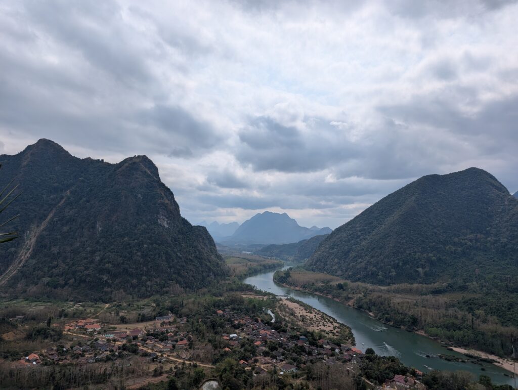 A mountain top view over the small village of Muang Ngoy.