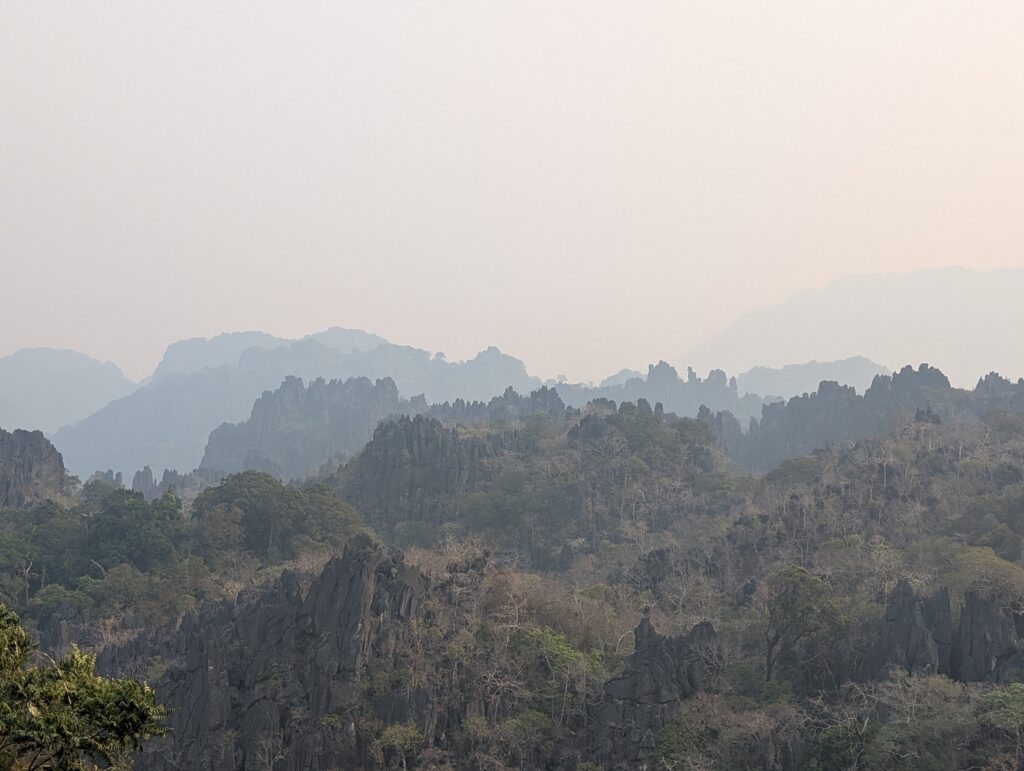 An amazing view across karsts, although it is very hazy due to the smoke.