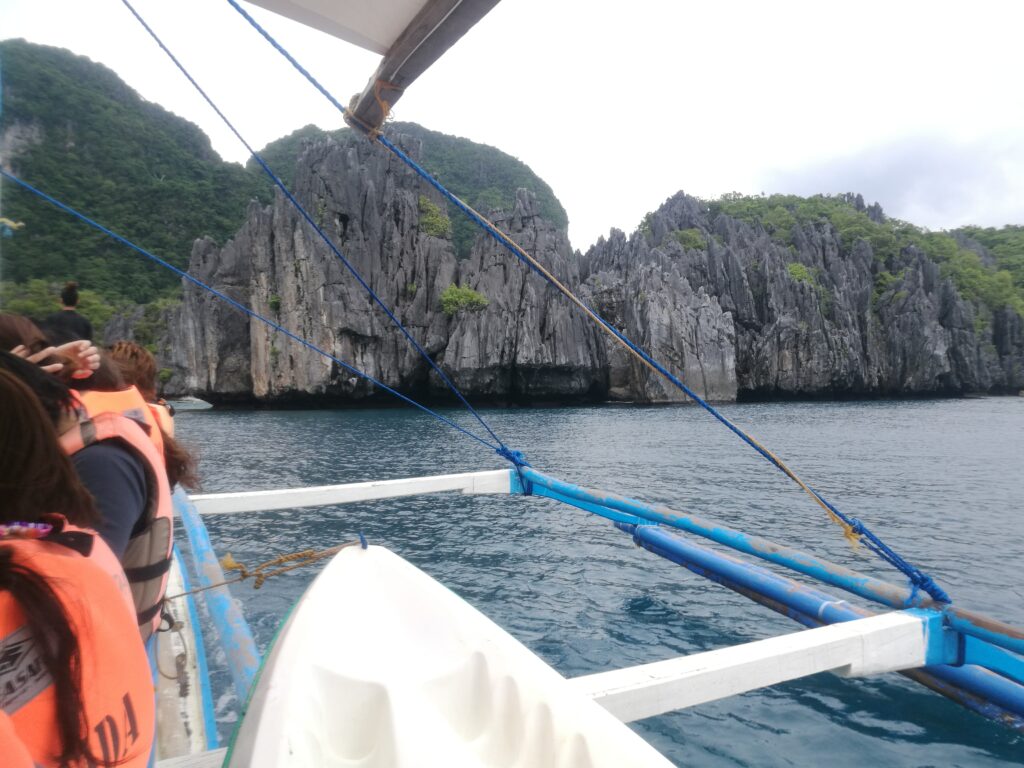 A picture from a boat tour in El Nido, 2015. You can see it is full of tourists, and you can see the rocky outcrops int he background.