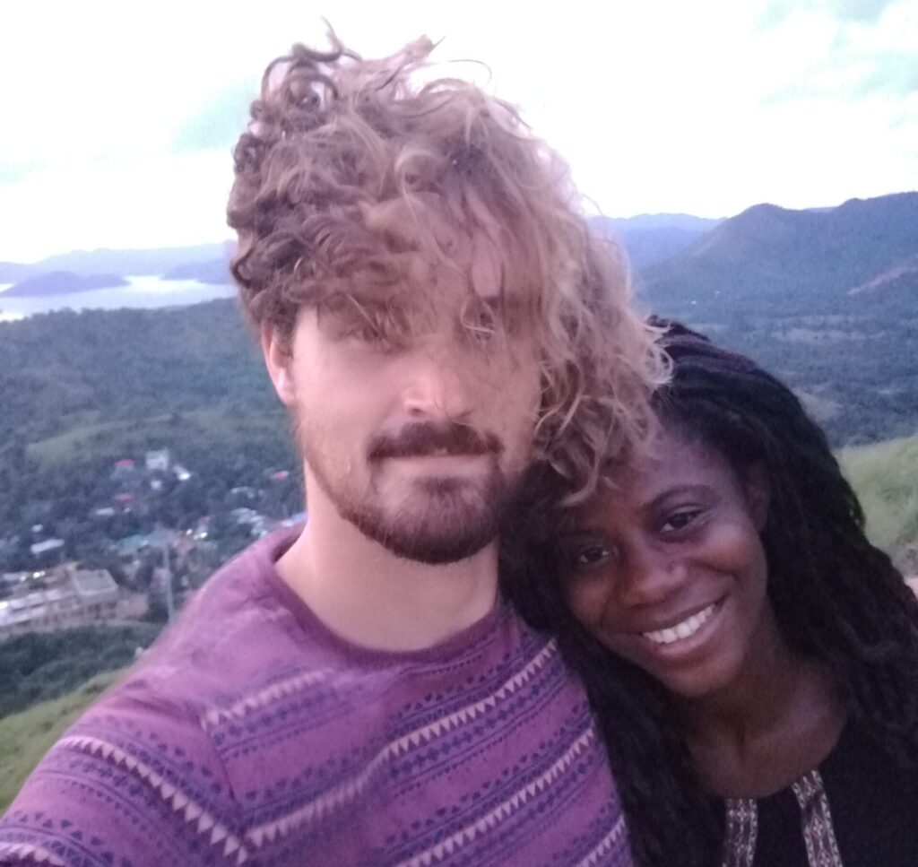 Mary-Ann and I standing on a windy hill in the in the Philippines back in 2016.
