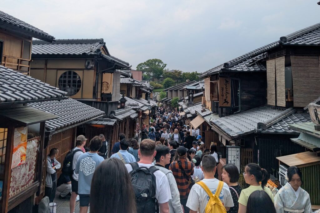 An image of a touristy street in Kyoto, filled to the brim with people.