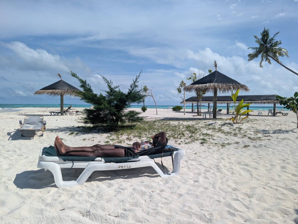 Mary-Ann relaxing on a sun-lounger on a near-empty maldivian beach!