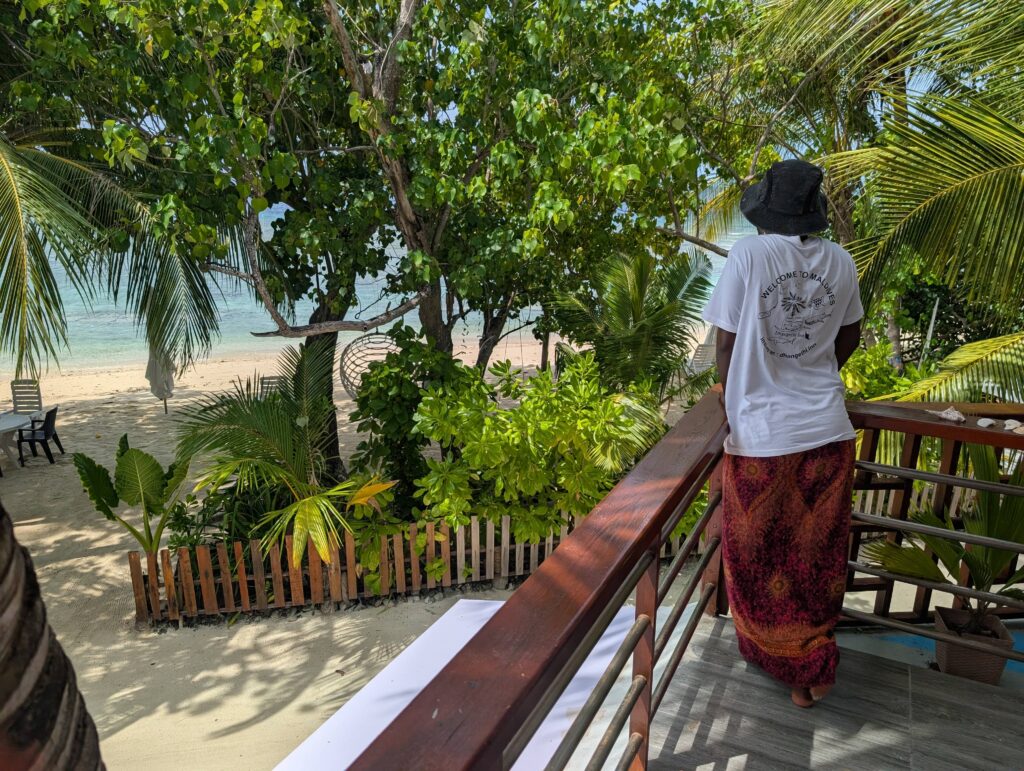 Mary-Ann standing on the balcony of a room we had on Mahibadhoo.