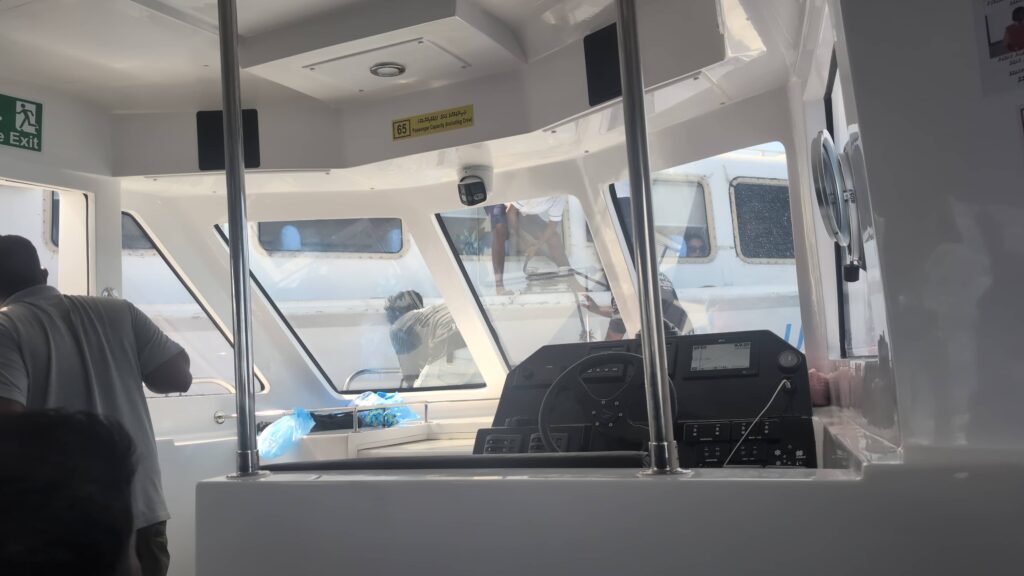 An image from inside a speedboat showing people trying to workout why the boat has broken down.