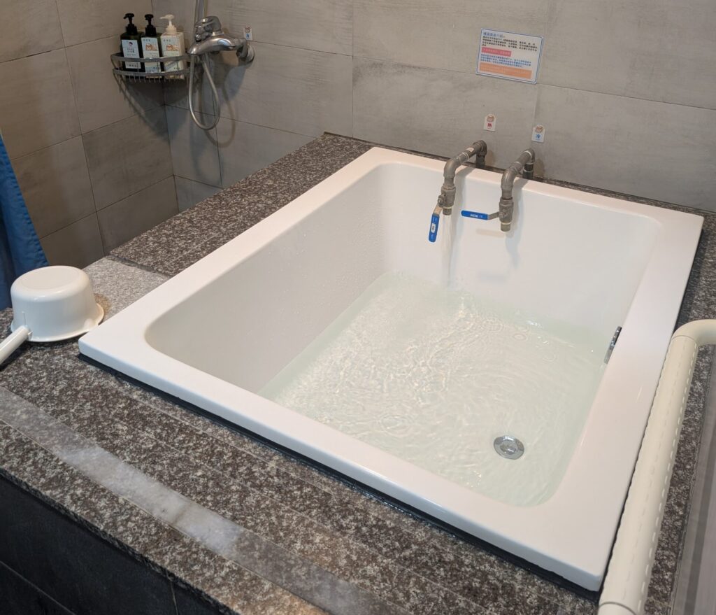 A picture of a Hot spring water fed tub in a hotel somewhere in Taiwan.